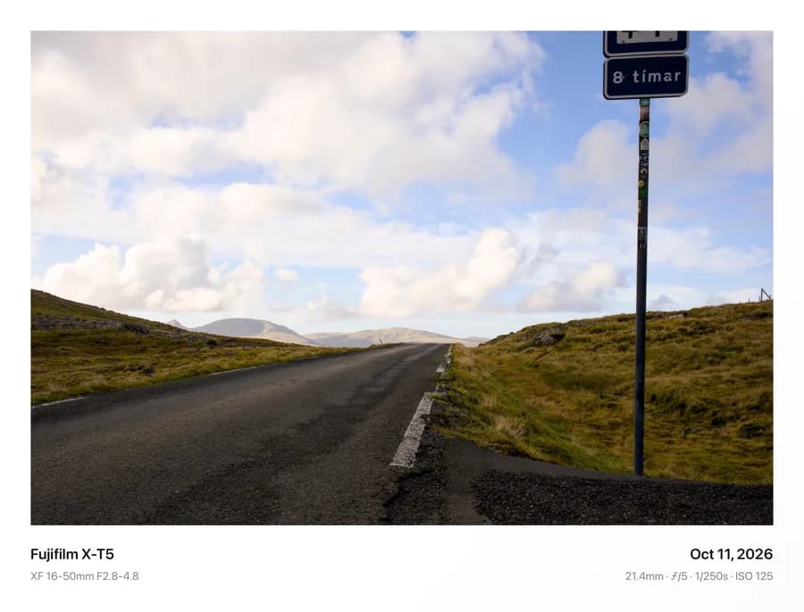 An open road under a wide sky, framed in Classic